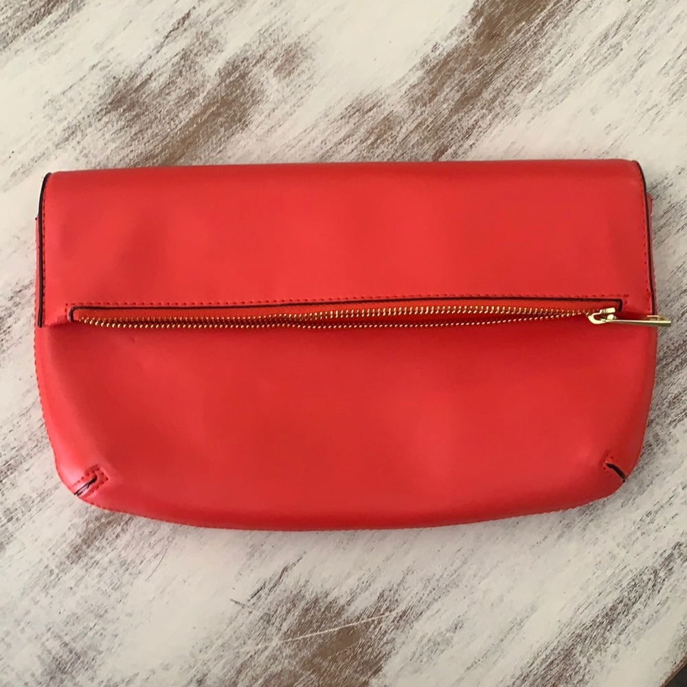 A New day clutch, red color with gold hardware
